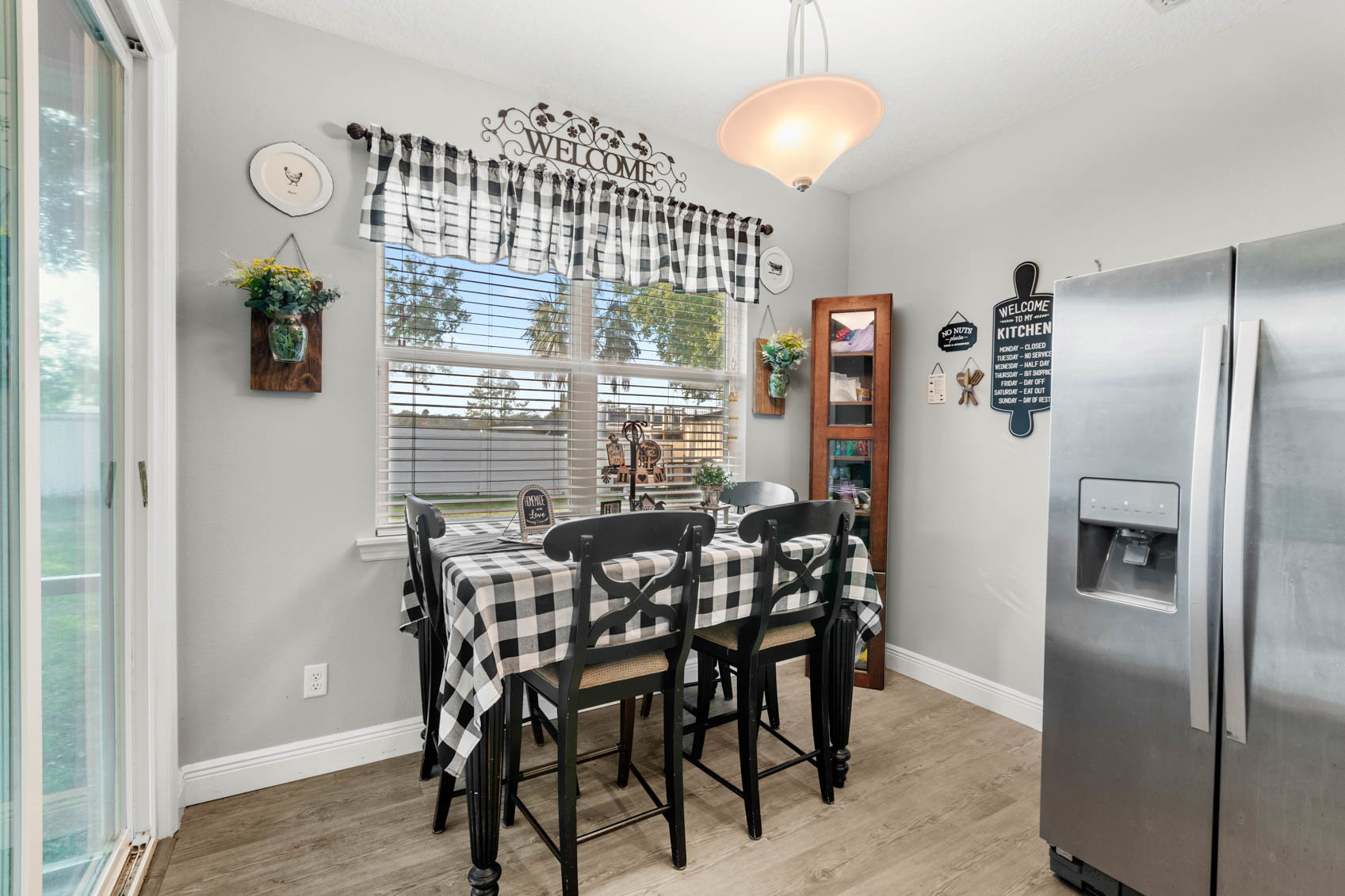 small dining space with black table and chairs